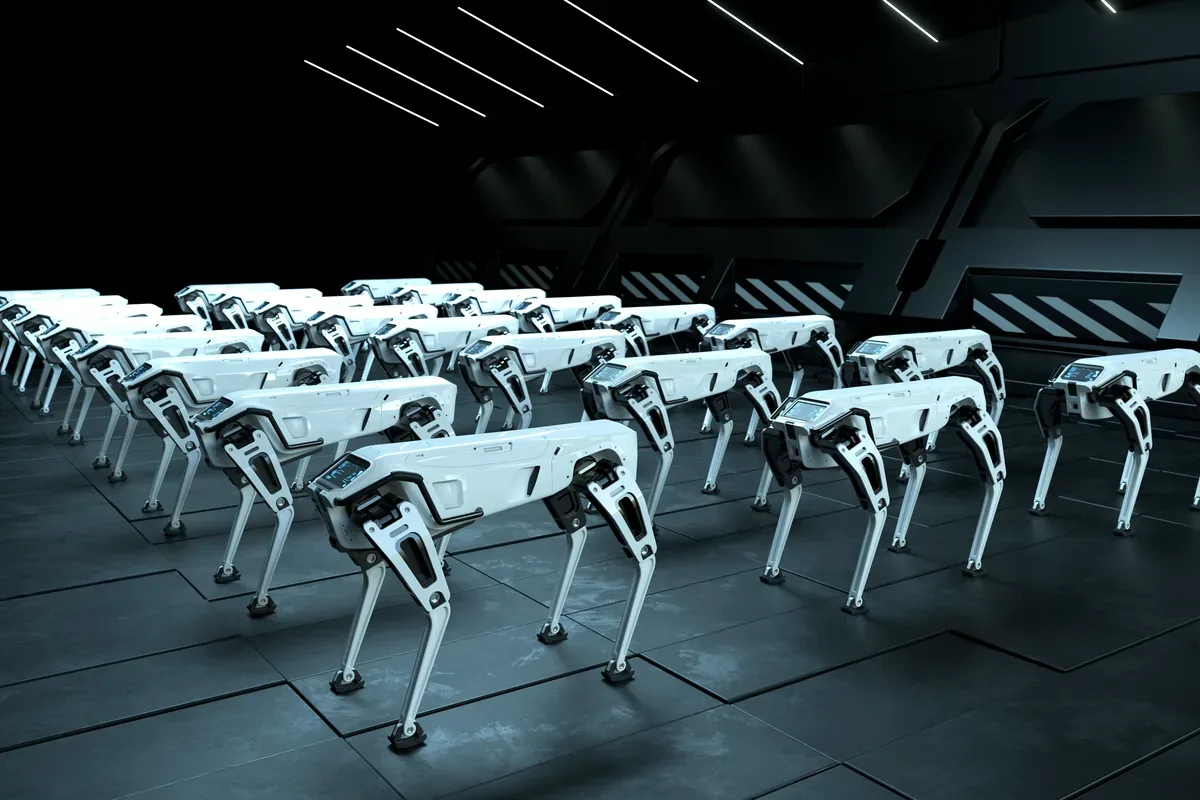 Filas de robots cuadrúpedos blancos en una nave oscura